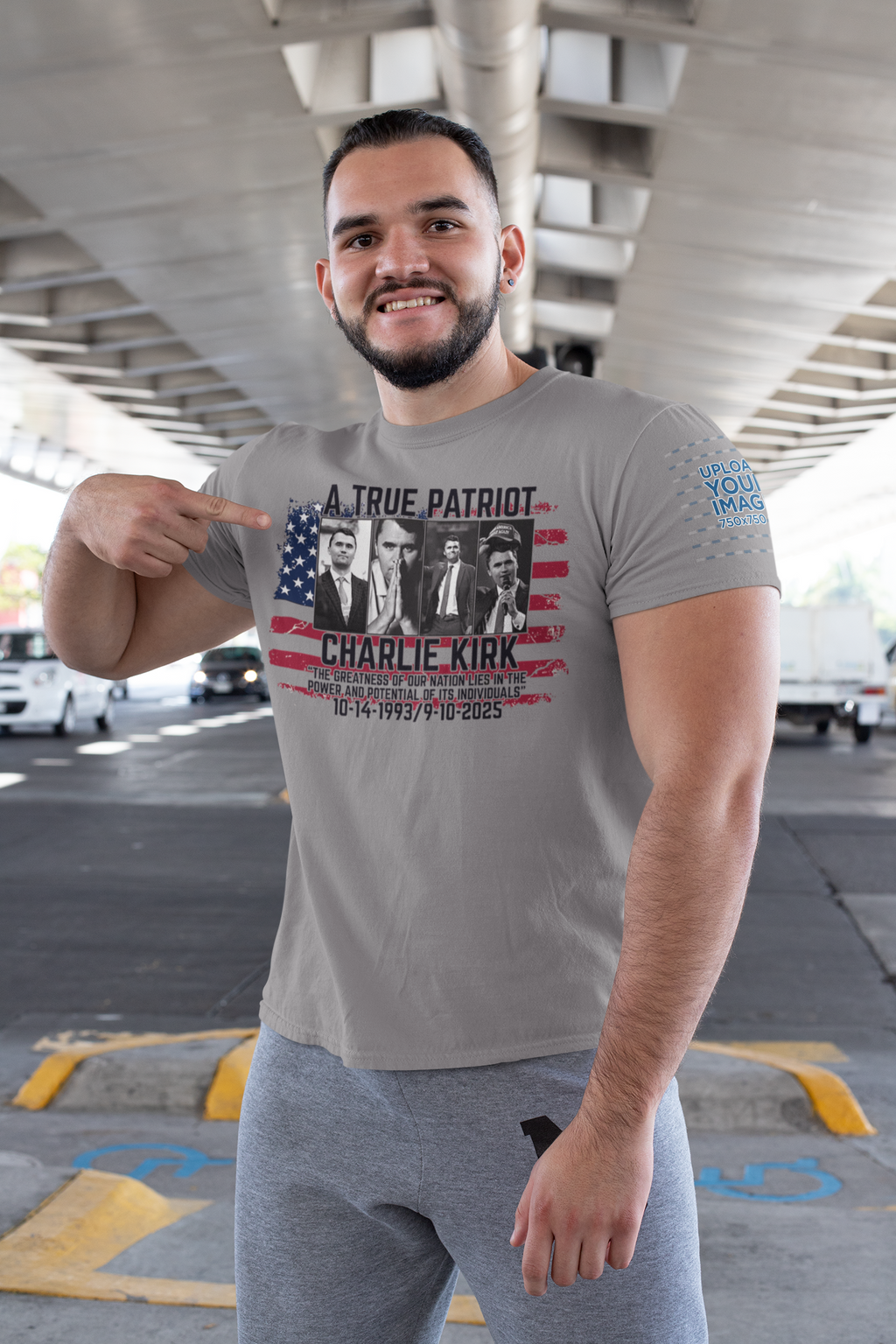 Man wearing Charlie Kirk A True Patriot Print t-shirt with patriotic design, posing proudly outdoors.