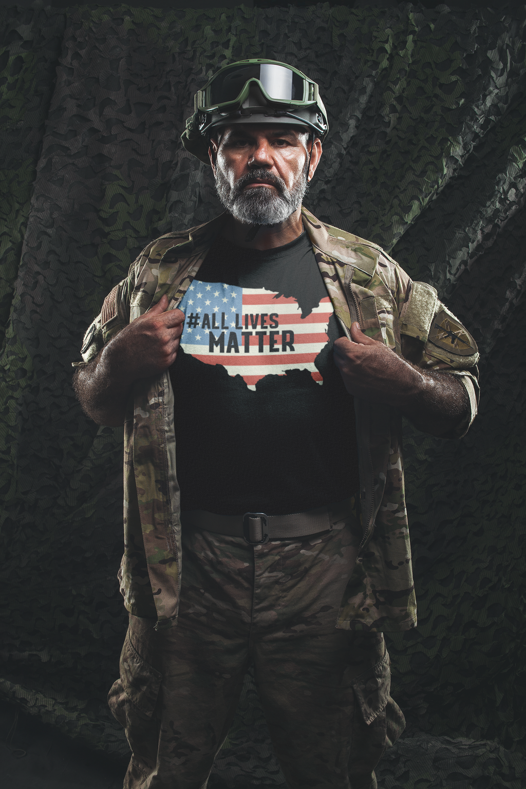 Man wearing Unity in America Map Patriotic Design Tee with a statement and military gear.