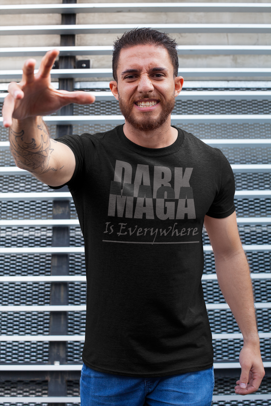 A person wearing a Dark MAGA Is Everywhere Apparel t-shirt, expressing confidence and conviction.