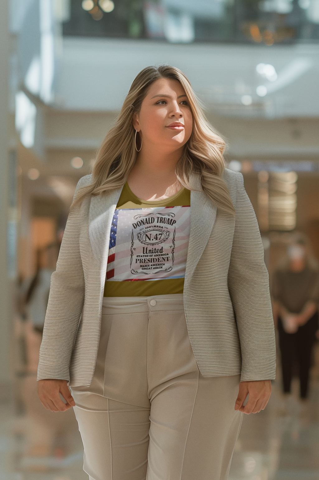 Woman wearing Donald Trump Number 47 Graphic shirt and stylish blazer in a modern shopping mall.