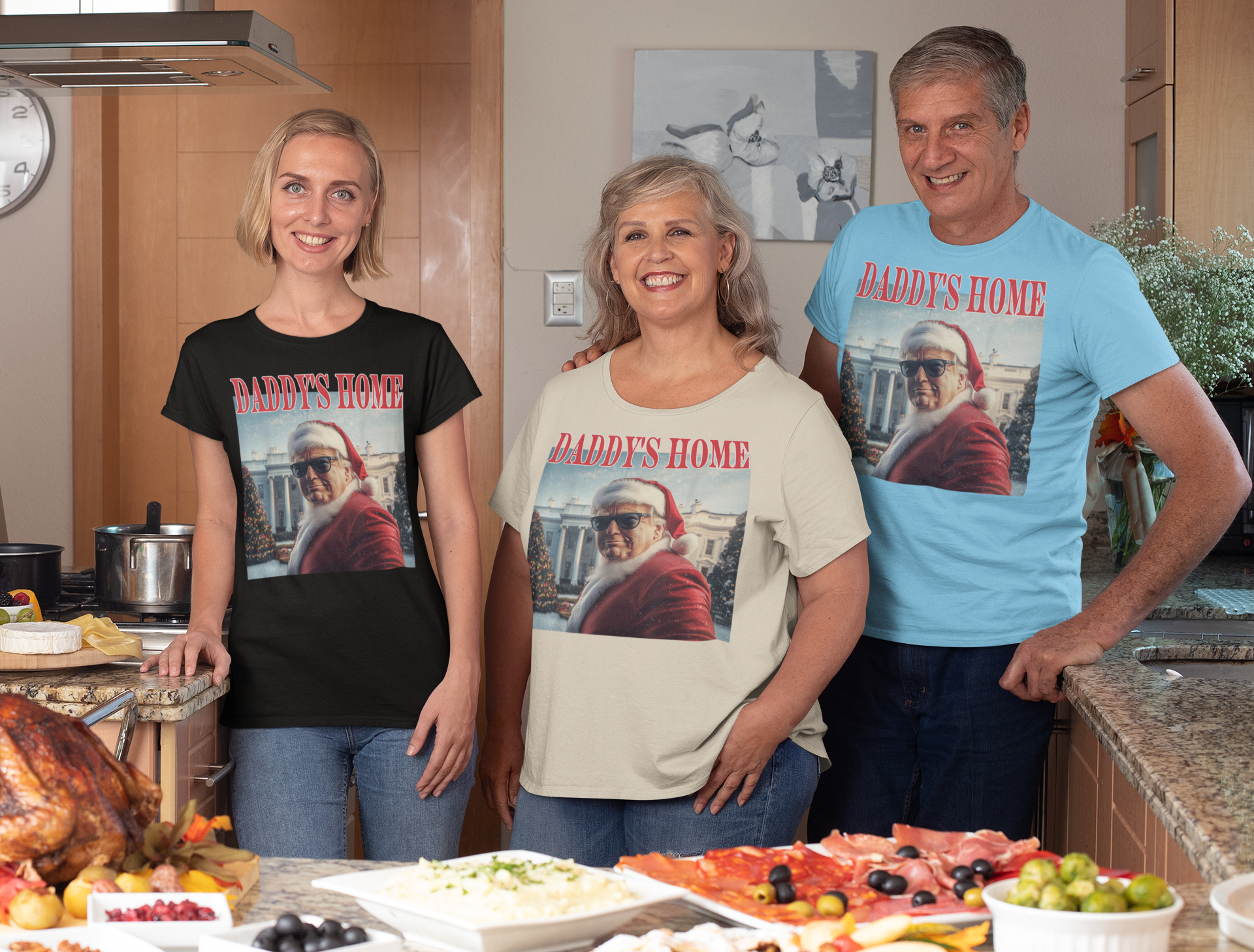 Three adults wearing Daddy is Home Trump As Santa Tee in a kitchen setting with food and festive decor.
