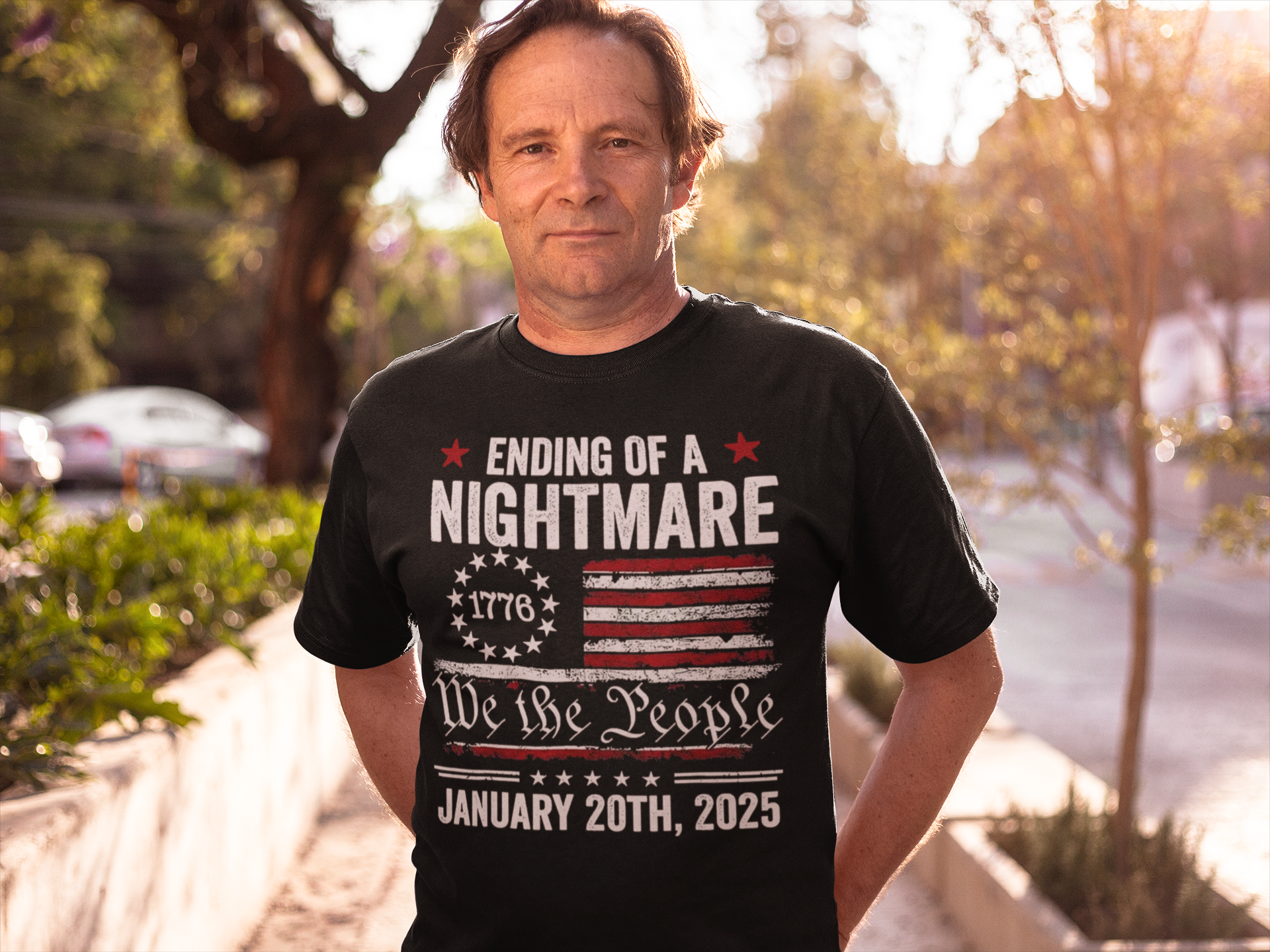 Man wearing a shirt displaying the Ending Of A Nightmare On 1776 Flag design with patriotic themes.