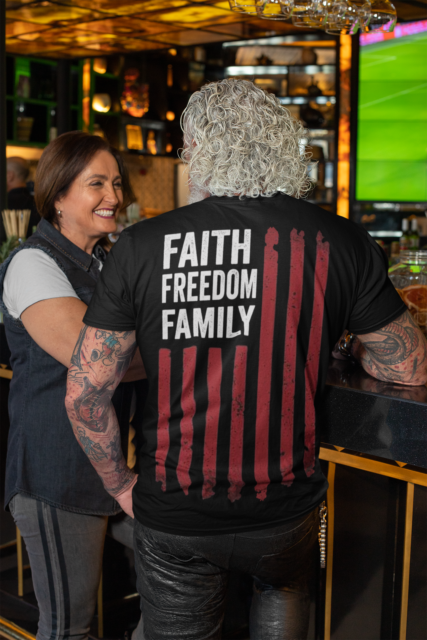 Model wearing a shirt with 'Faith Freedom Family Image On Back' design, showcasing bold values in a stylish setting.