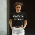 Woman wearing Give America Balls Again 2028 Design t-shirt in black, promoting patriotism and personal values.