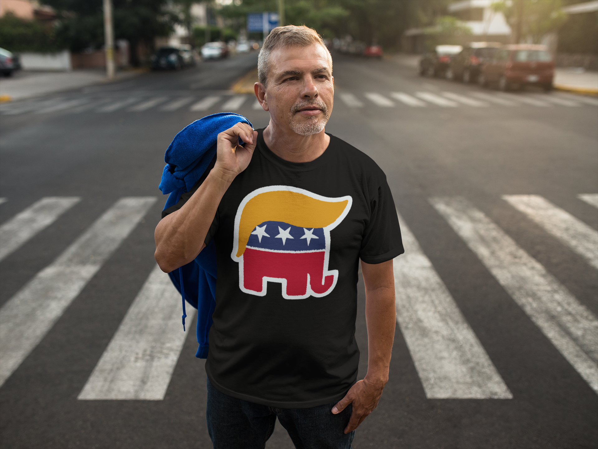 Man wearing GOP Symbol with Hair Vintage Shirt in a city street, showcasing unique political apparel design.