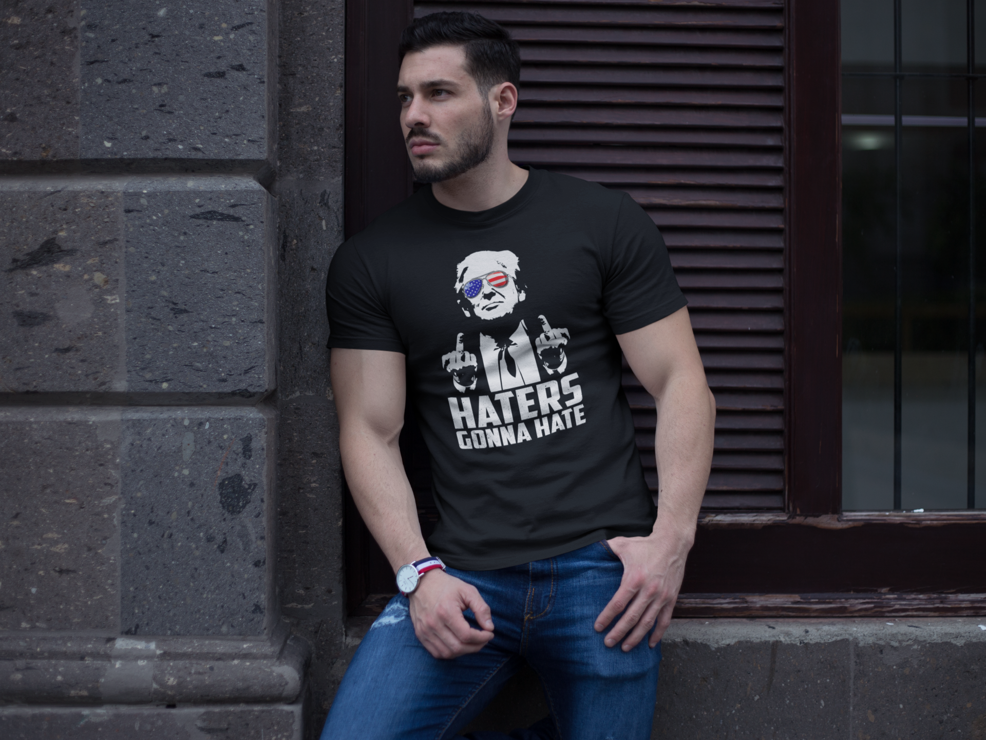 Man wearing a black t-shirt featuring the Haters Gonna Hate Graphic Design, highlighting a bold statement.