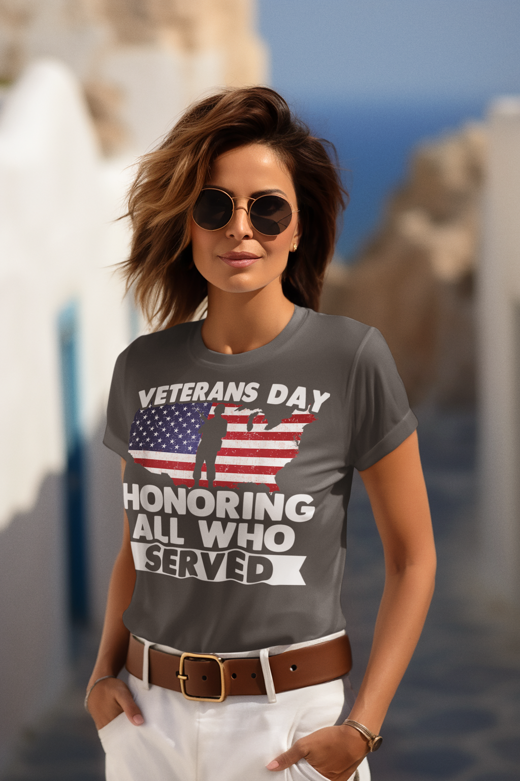 Veterans Day Honoring Our Heros graphic t-shirt worn by a woman outdoors with a blurred background.