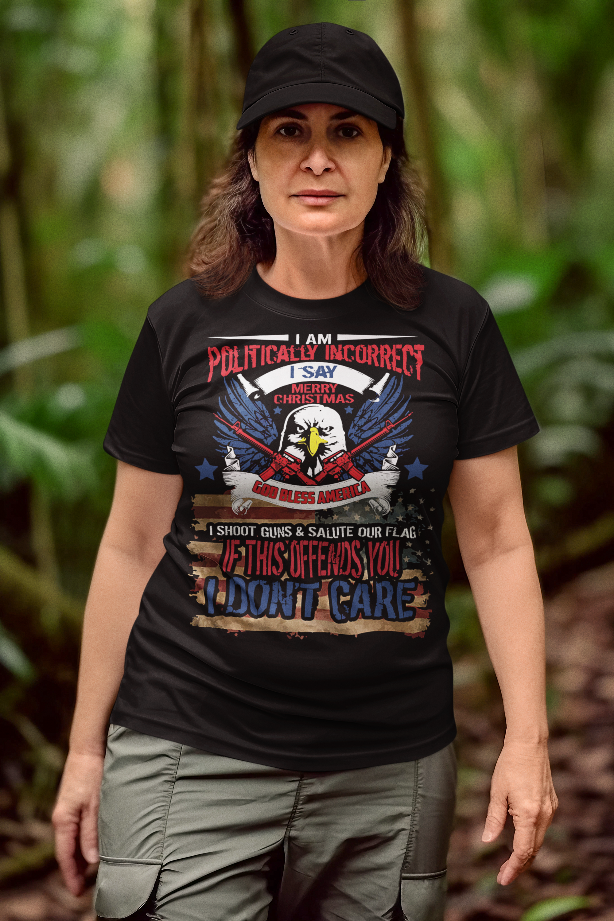 Woman wearing "God Bless America Patriotic Christmas Design" t-shirt with bold conservative message, standing outside.