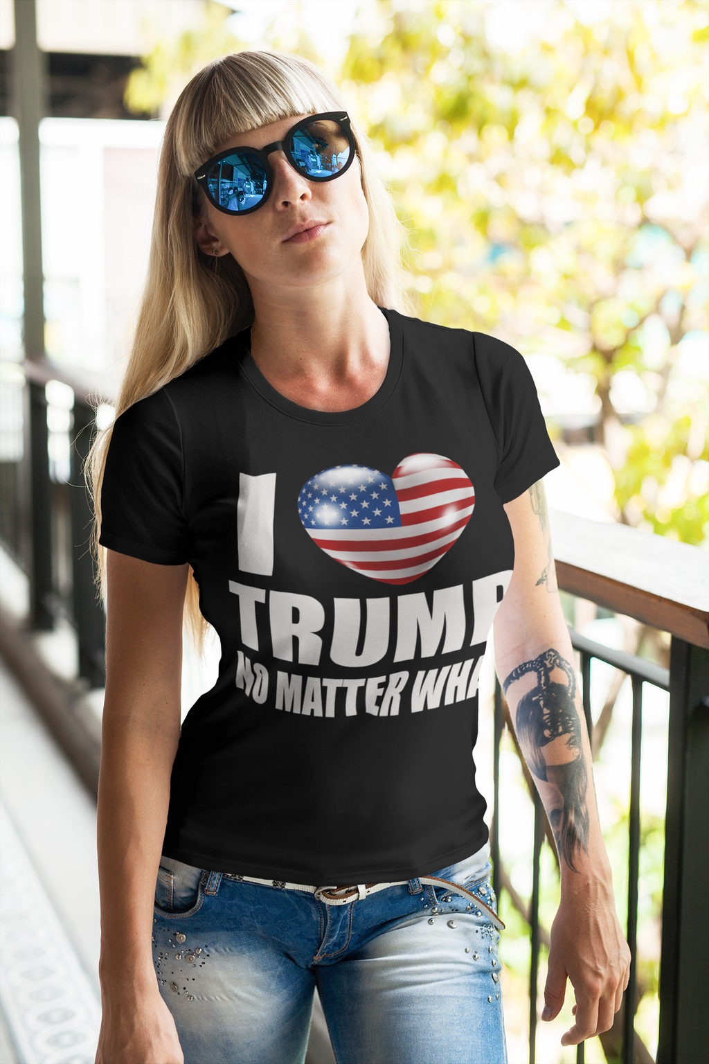 I Heart Trump No Matter What Tee worn by a woman in sunglasses standing outdoors with trees in the background.