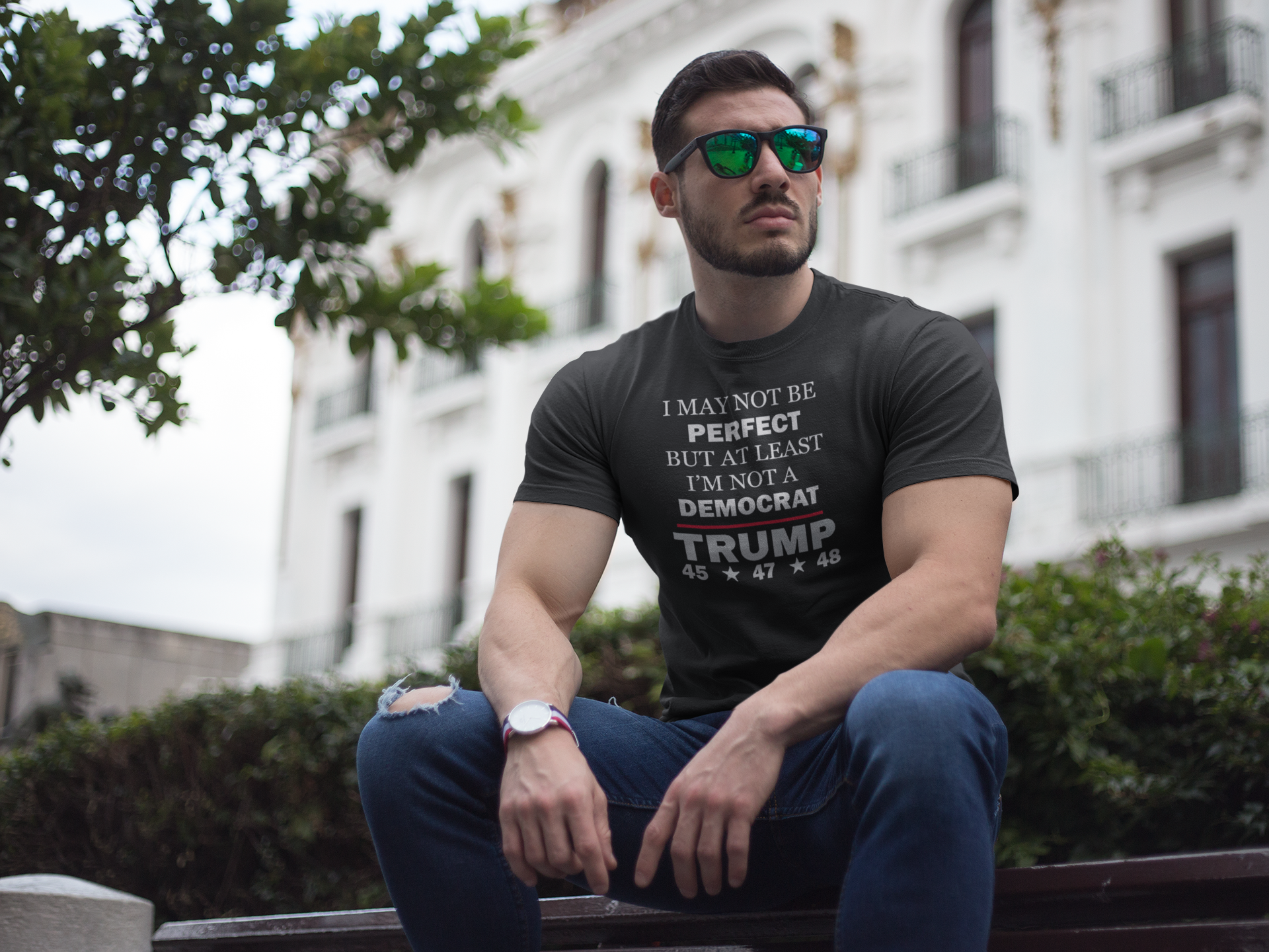 Man wearing I May Not Be Perfect But At Least I'm Not A Democrat t-shirt outdoors with sunglasses.