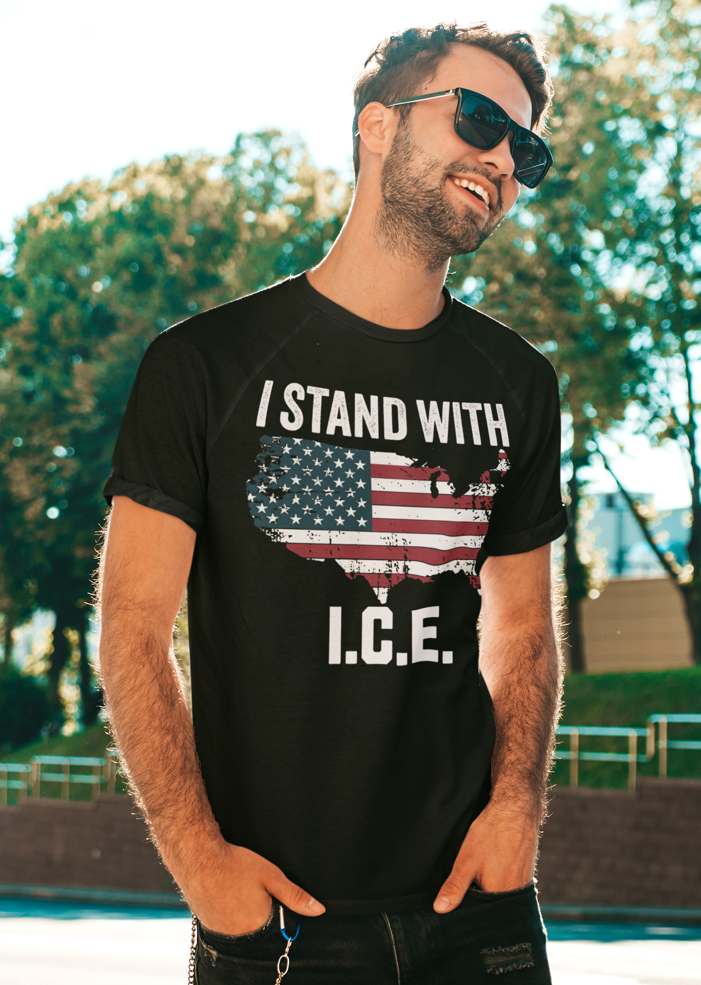 Man wearing a shirt that says 'I Stand With I.C.E.' against a backdrop of trees, promoting 'Why I Stand With ICE Every Day'.
