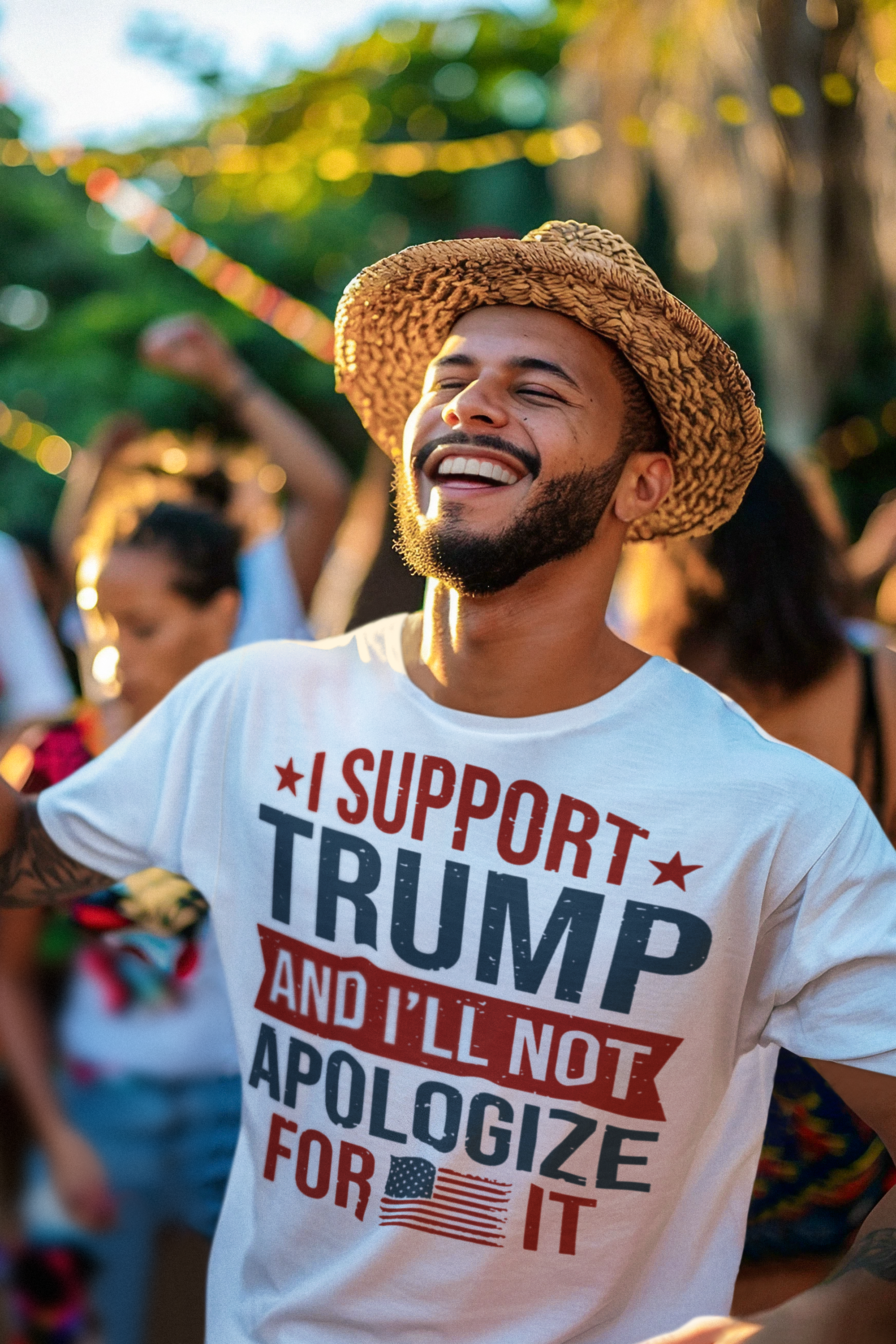Man wearing a shirt that says I Support Trump And I'll Not Apologize For It, smiling at a party.