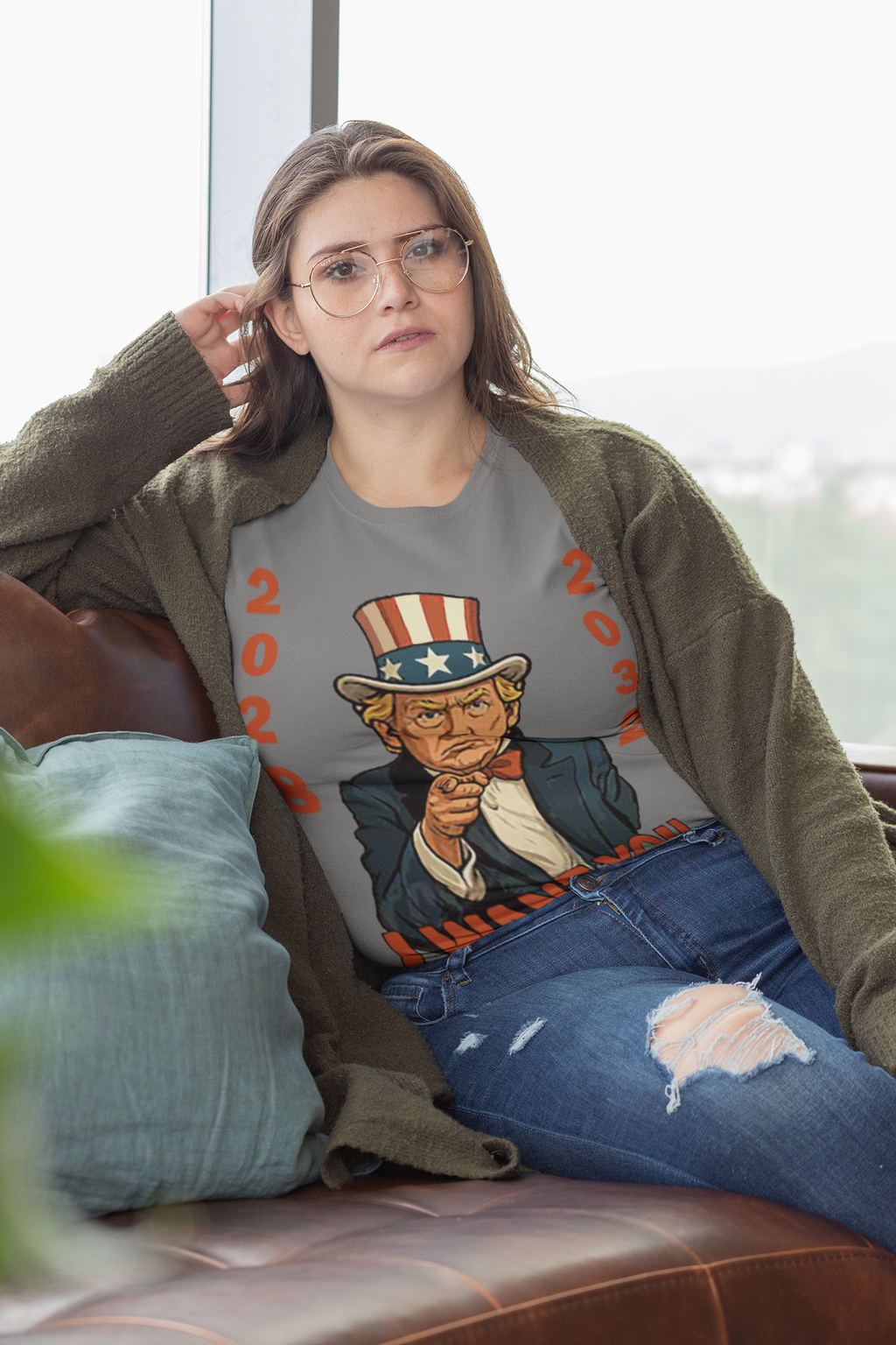 I Want You To Party Campaign 2028 Shirt worn by a model relaxing on a couch, featuring a patriotic design.