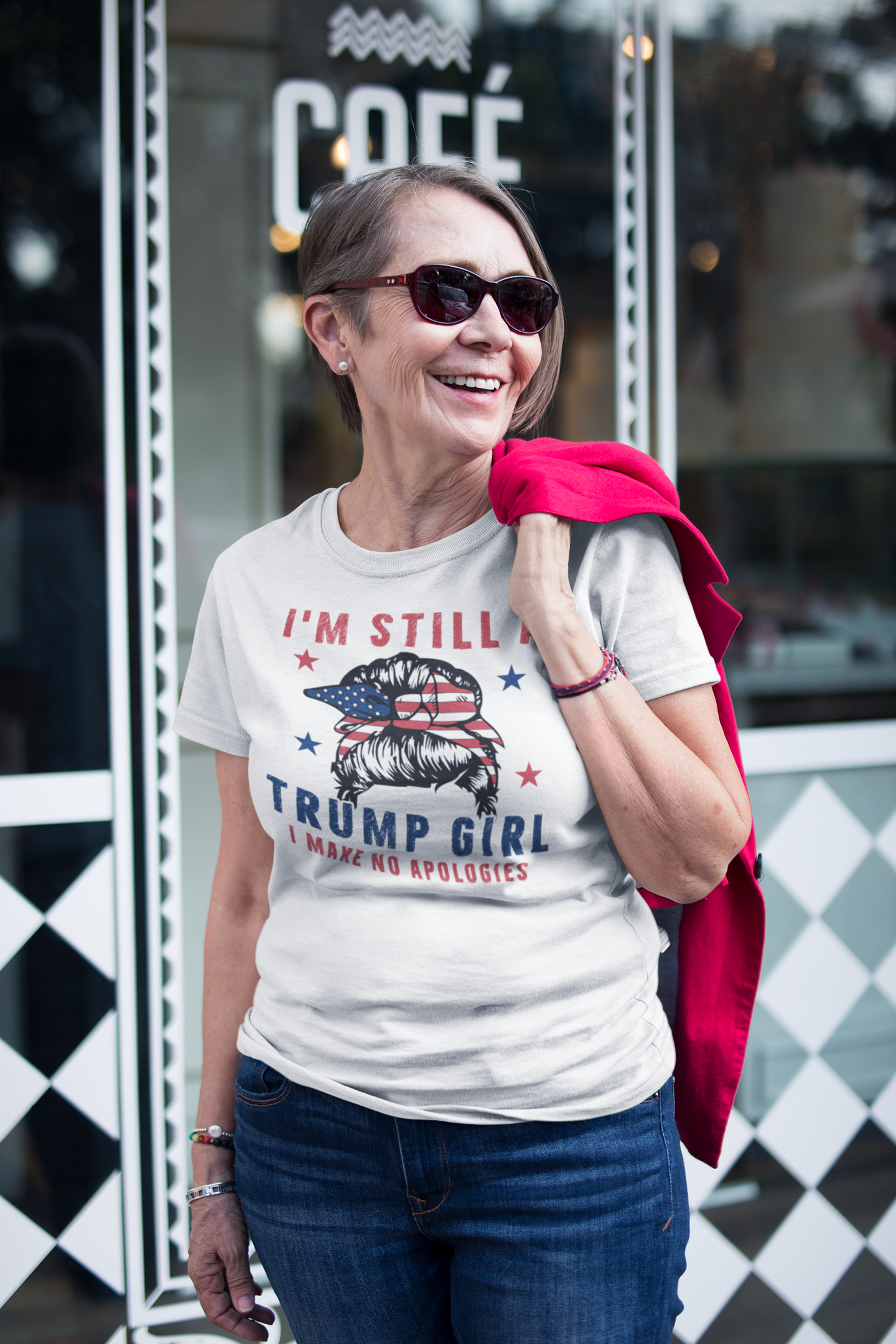 Woman wearing Proud Trump Girl Official Style t-shirt outside café