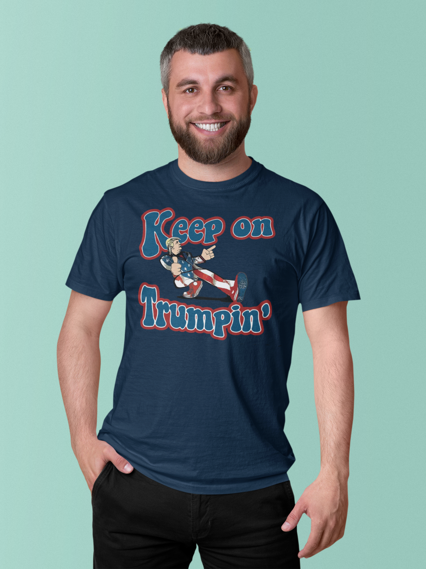 A man wearing a navy t-shirt featuring the Keep On Trumpin' Vintage Design illustration.