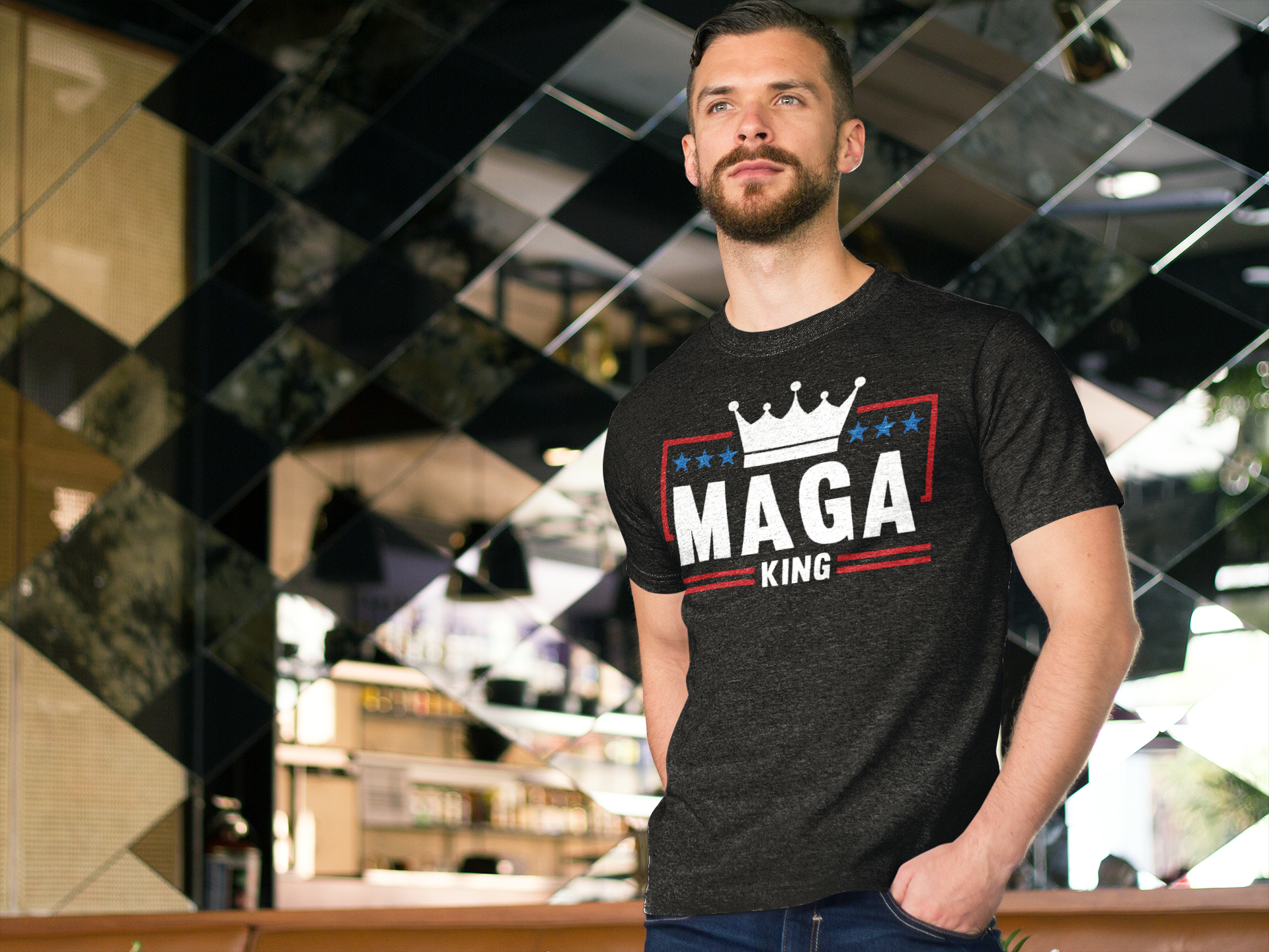 Man wearing MAGA King American Pride Shirt in a stylish indoor setting with modern decor.
