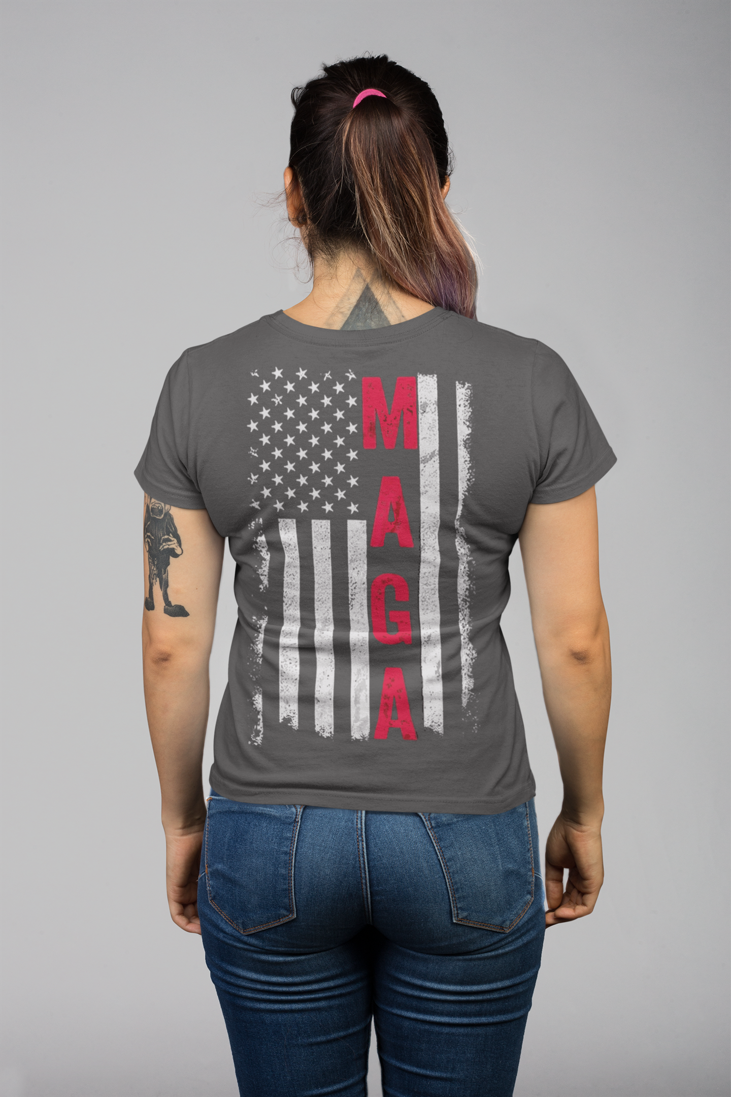 MAGA Black White Flag Graphic Shirt displayed on a person from the back, featuring a distressed flag and MAGA lettering.