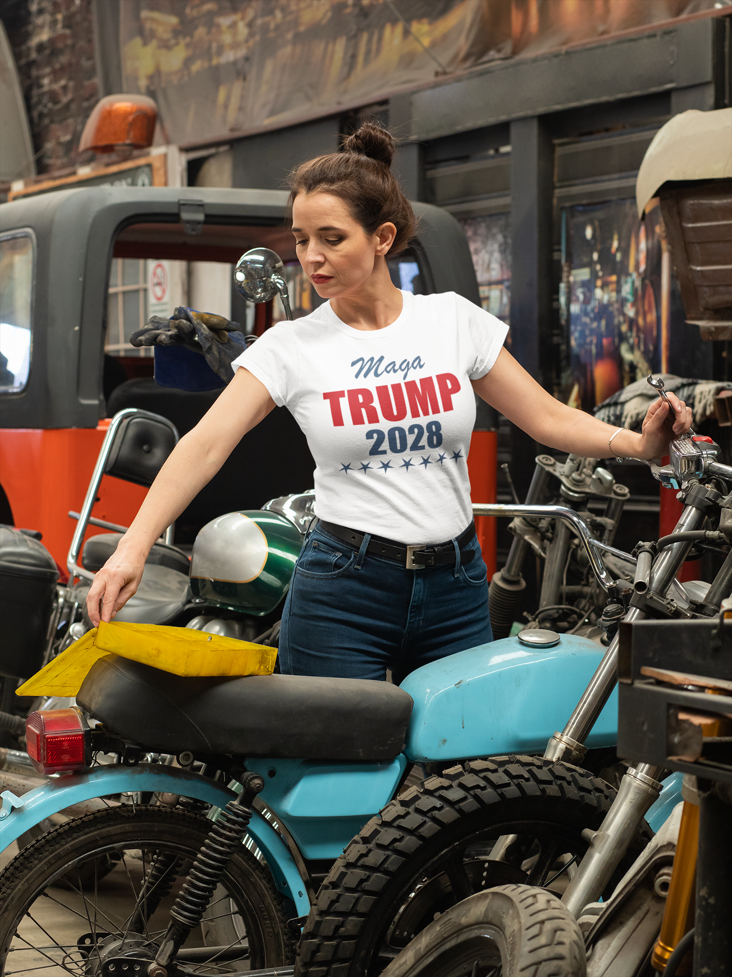 MAGA Trump 2028 Campaign Style apparel worn by a woman in a garage with motorcycles.