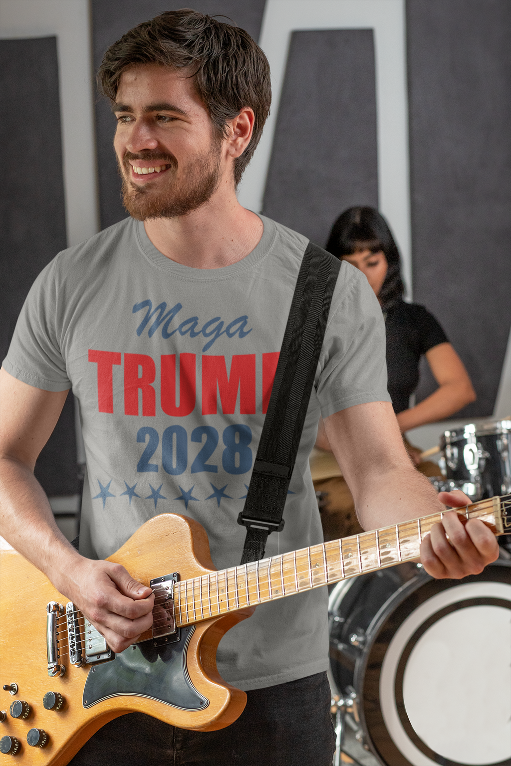 Man playing guitar in MAGA Trump 2028 Campaign Style t-shirt, showcasing patriotic support for the campaign.