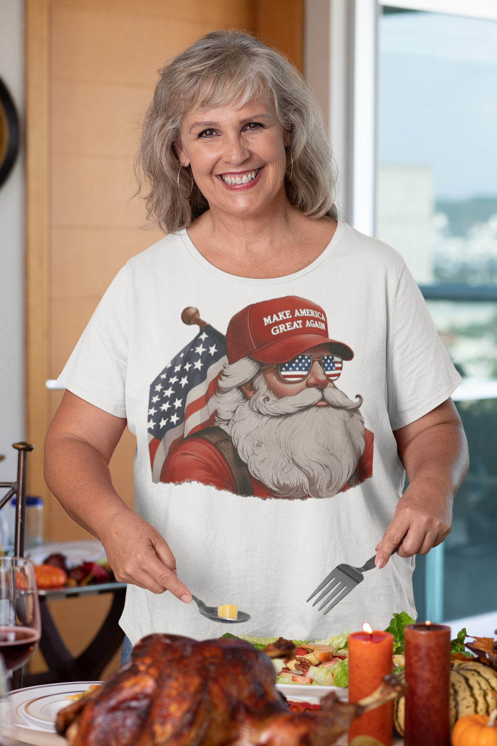 MAGA Santa With Flag Apparel Art worn by a smiling woman at a holiday dinner table with festive food.