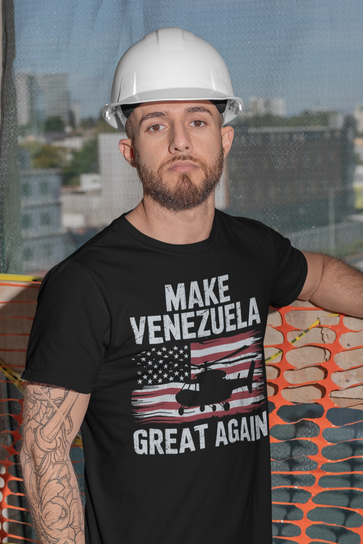 Man wearing a black shirt with the phrase Make Venezuela Great Again With Helicopter and an American flag design.