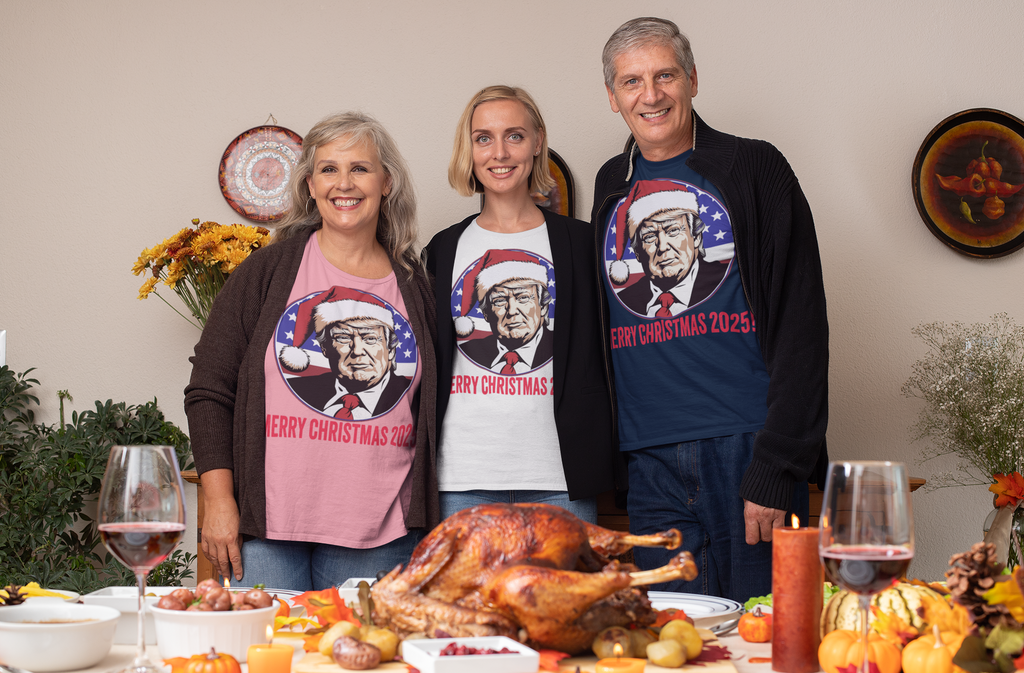 Family wearing Merry Christmas 2025 Trump As Santa graphic t-shirts at a festive dinner table.