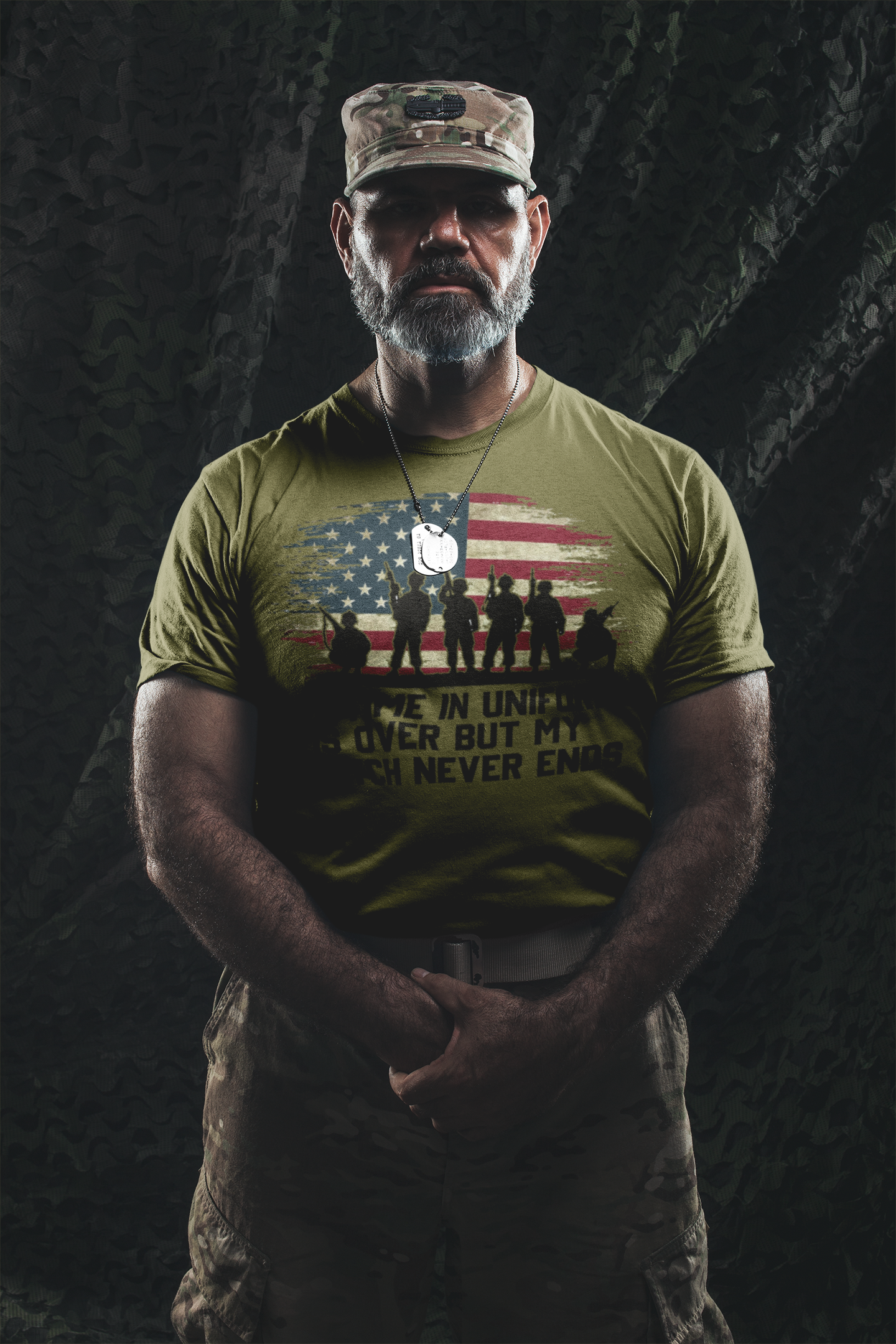 My Time In Uniform Is Over But My Watch Never Ends apparel worn by a veteran against a military backdrop.