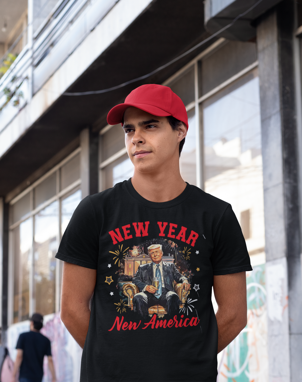 A young man wearing a black t-shirt with a New Year New America Freedom Design graphic, showcasing patriotism and renewal.