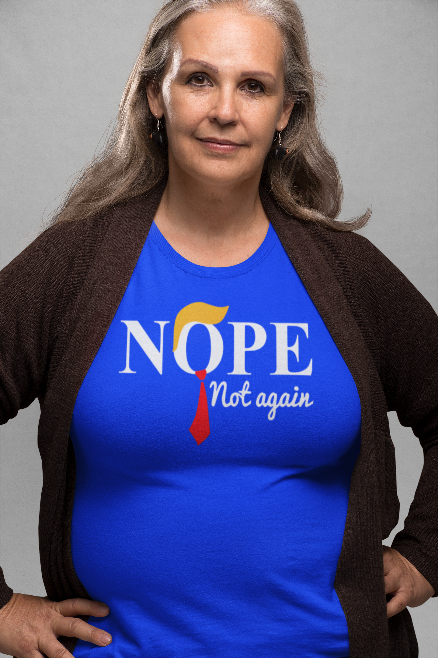 Woman wearing a blue Nope Not Again Trump Hair & Tie graphic tee, promoting personal values and community support.