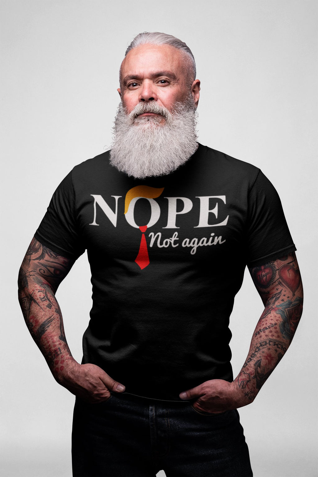 Man with a beard wearing Nope Not Again Trump Hair & Tie graphic tee, expressing political conviction.