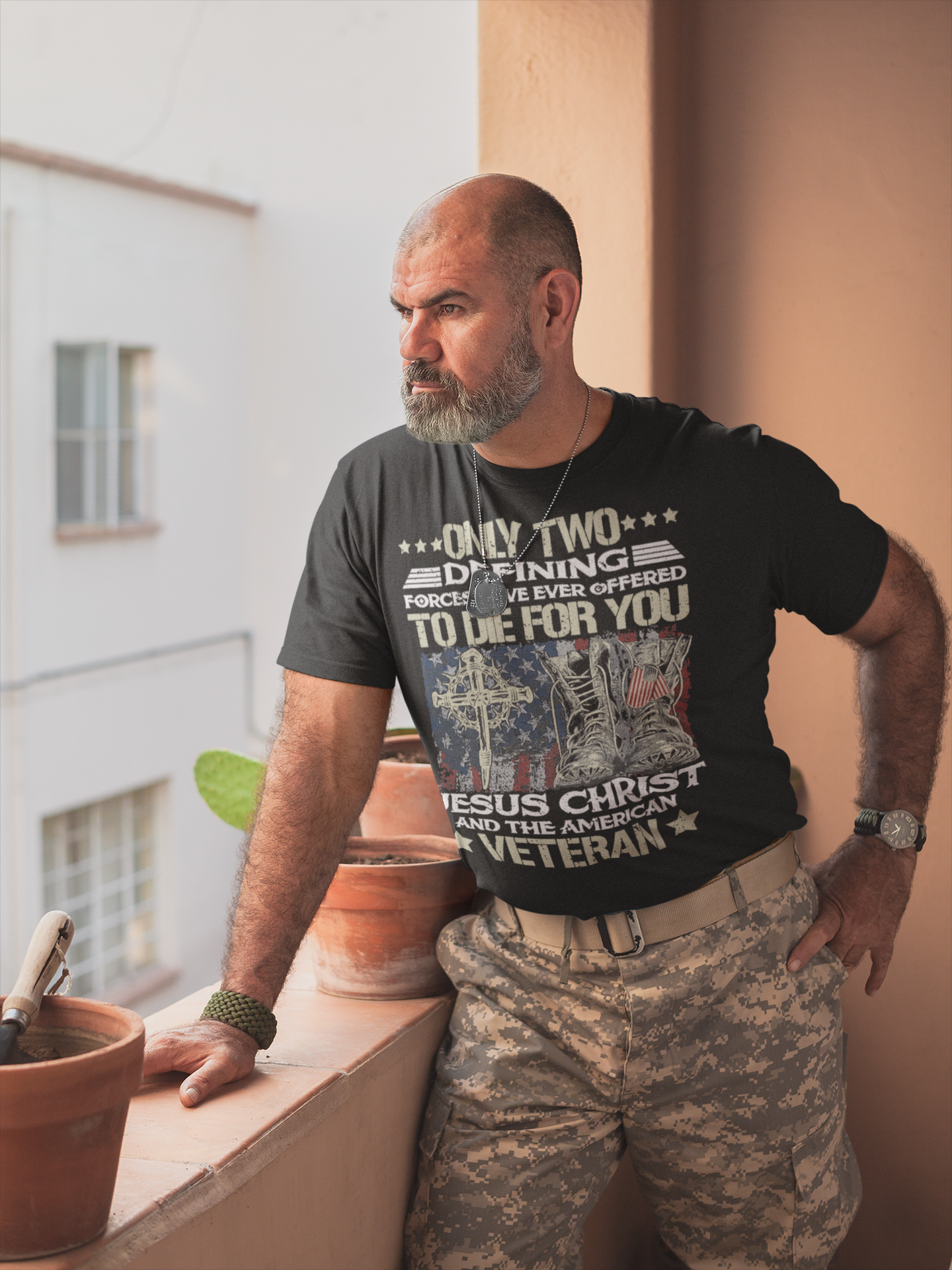 Man in military-style apparel showcasing 'Honor Jesus Christ and American Veterans' t-shirt design.