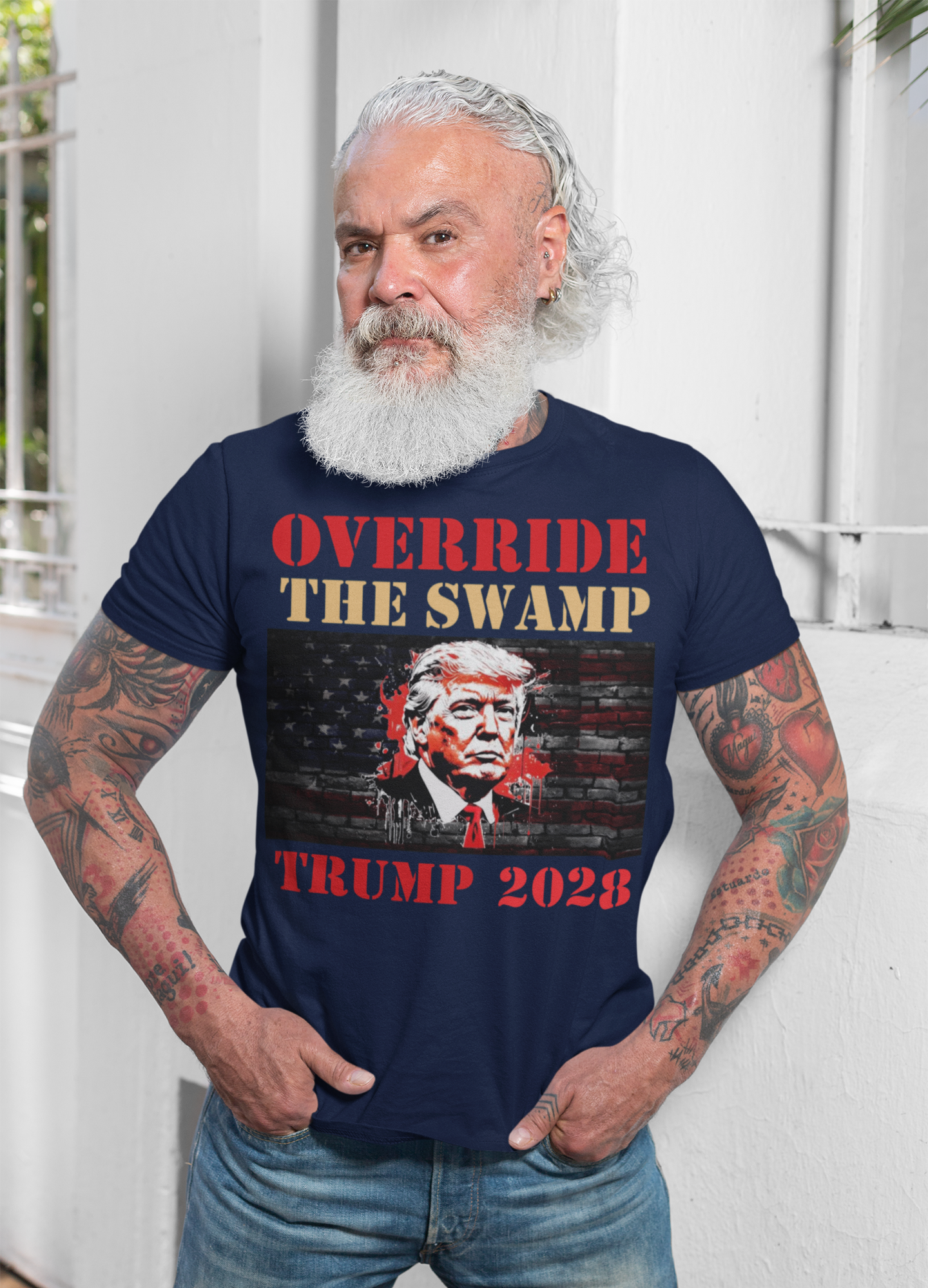 Override The Swamp Trump 2028 Graphic t-shirt design featuring man with beard and tattoos.