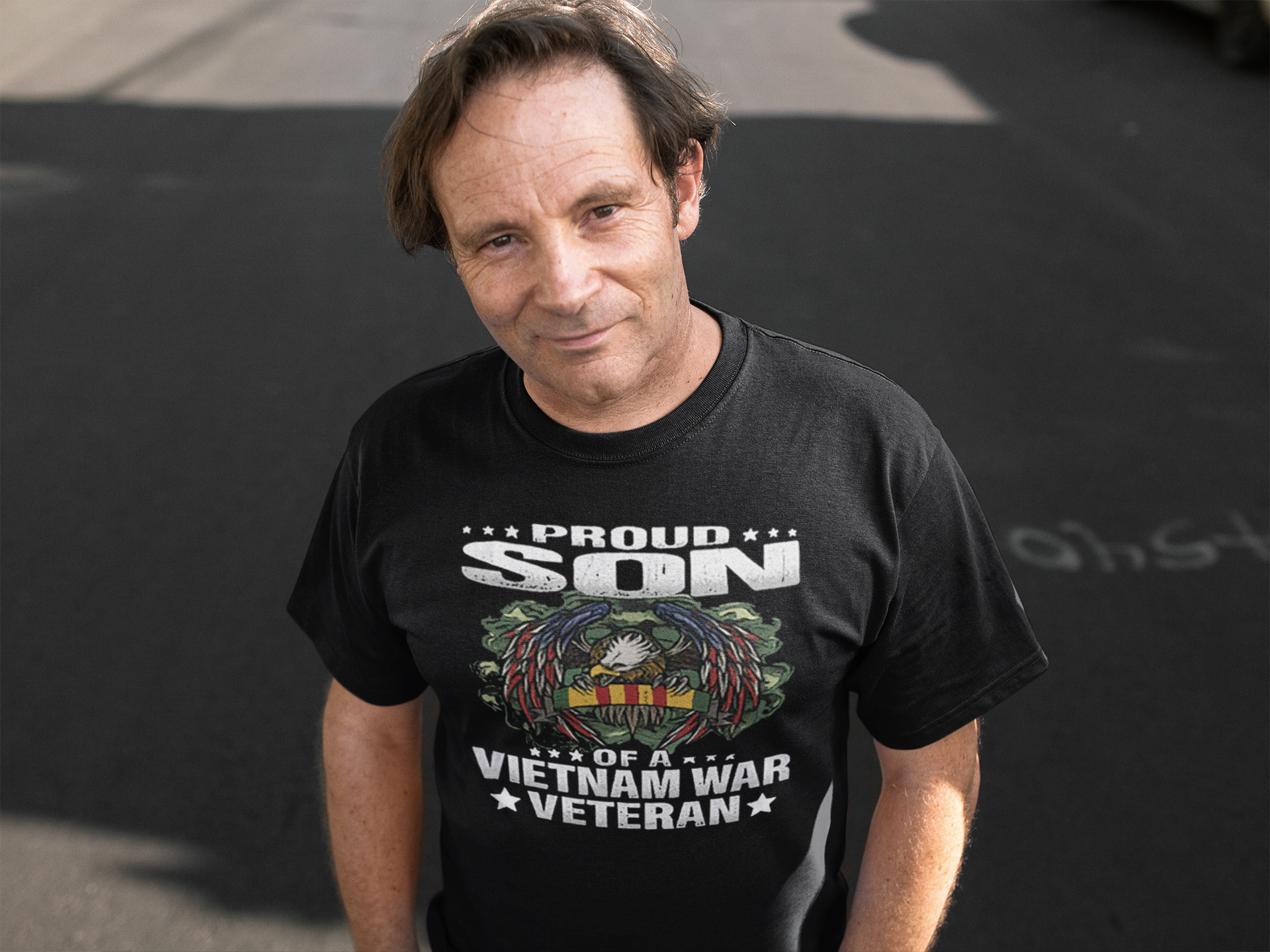 Man wearing Proud Son Of A Vietnam War Veteran t-shirt, honoring military legacy with a meaningful design.