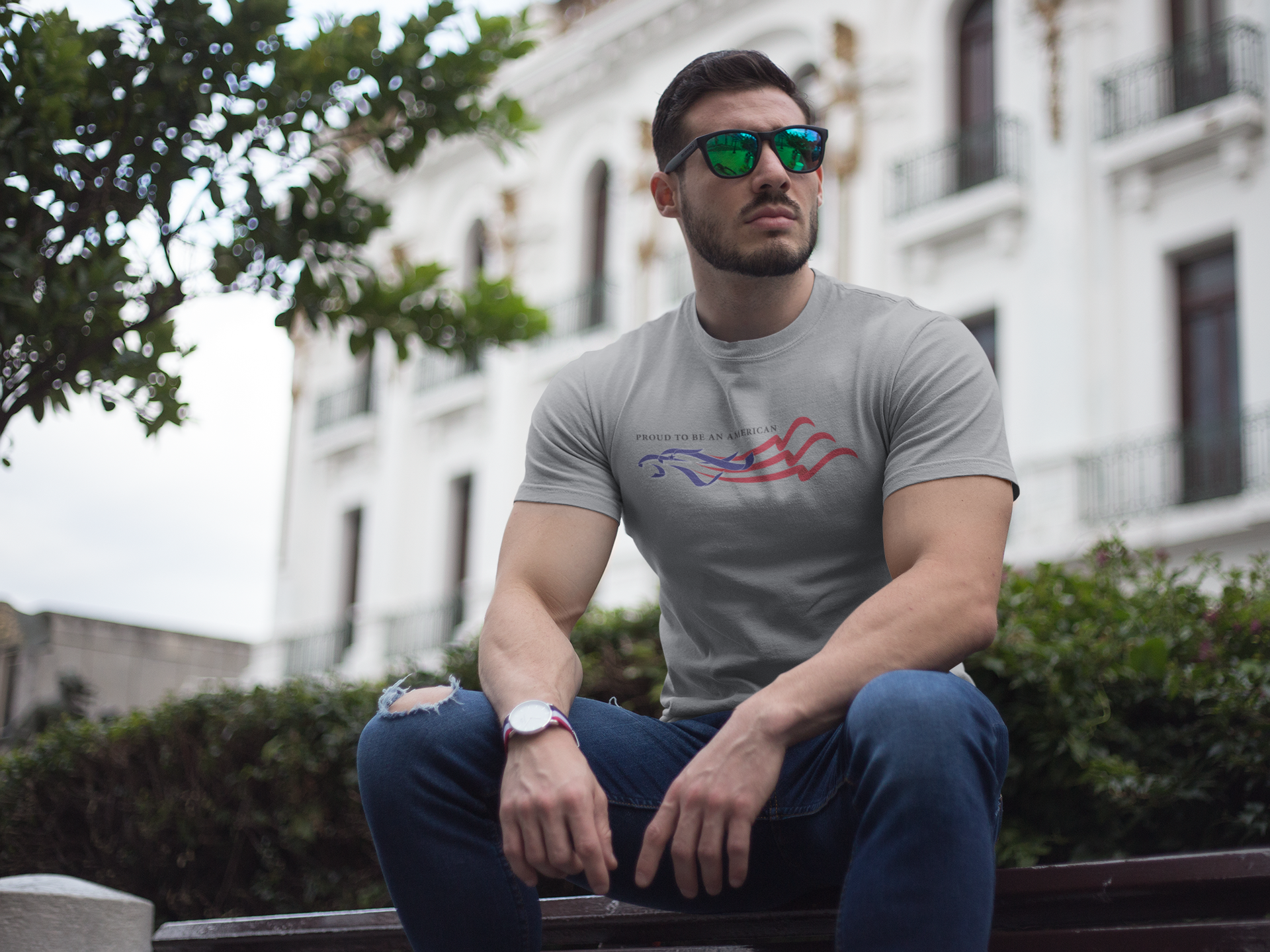 Man wearing t-shirt with Proud To Be An American Eagle Flag design outdoors