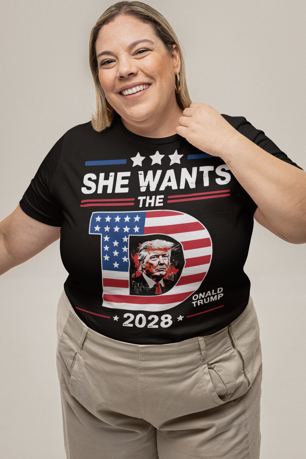 Woman wearing She Wants The Voice 2028 Election Shirt with American flag theme and Donald Trump graphic.