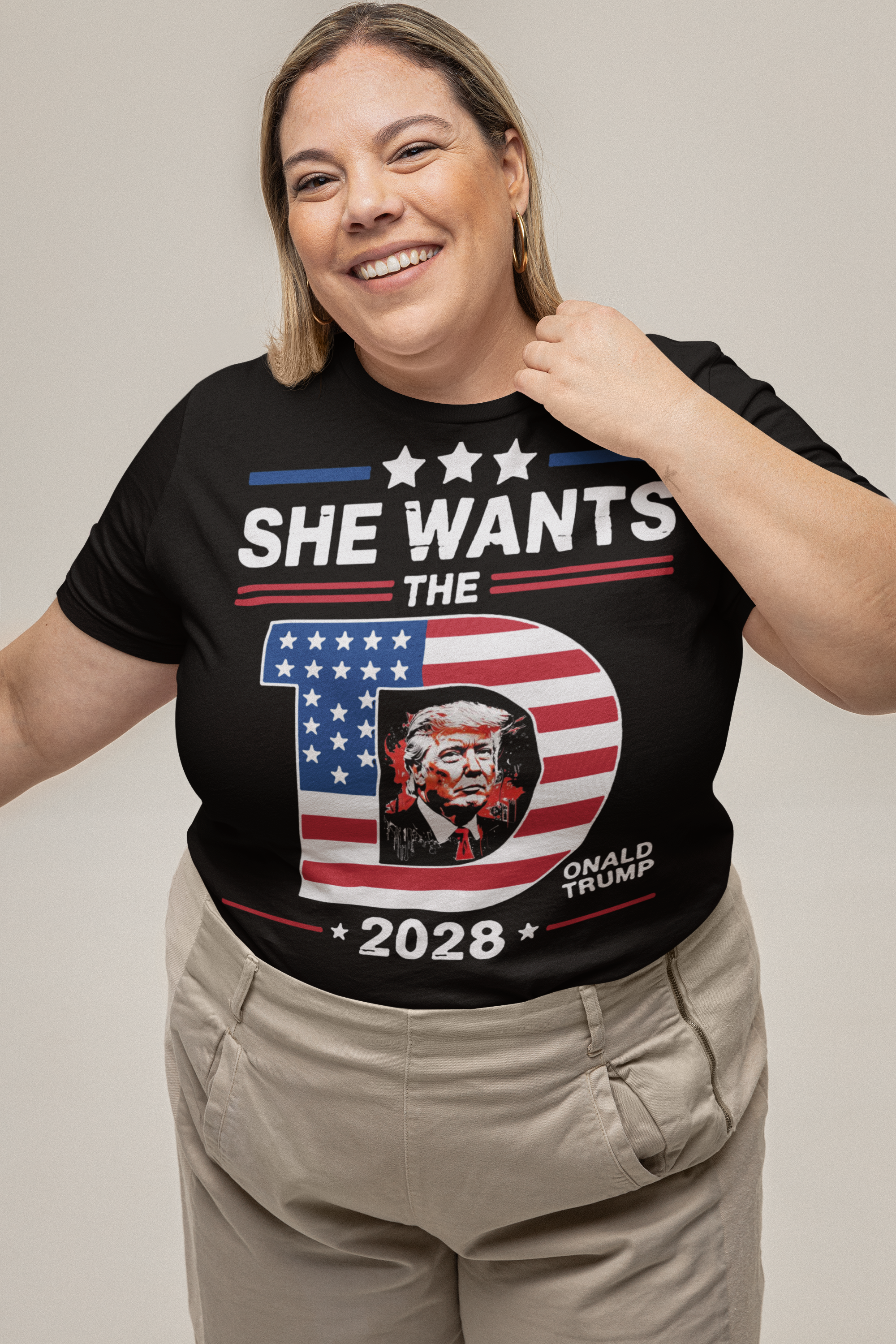 Woman wearing She Wants The Voice 2028 Election Shirt with American flag theme and Donald Trump graphic.