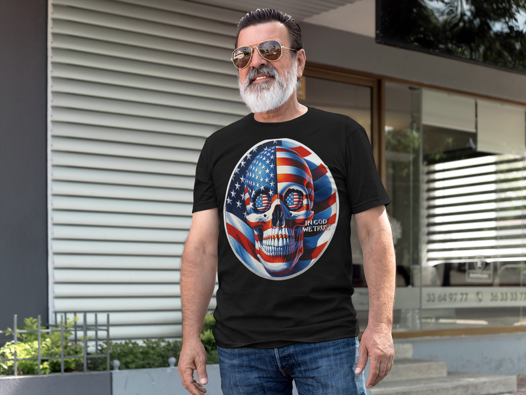 Man wearing Punisher In Stars And Stripes In God We Trust t-shirt outdoors, showcasing conservative message.