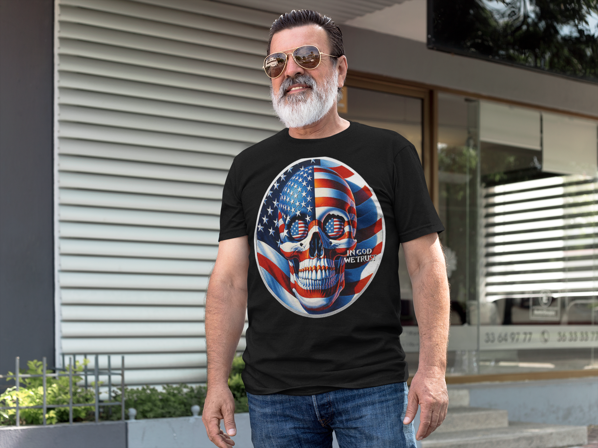 Man wearing Punisher In Stars And Stripes In God We Trust t-shirt outdoors, showcasing conservative message.