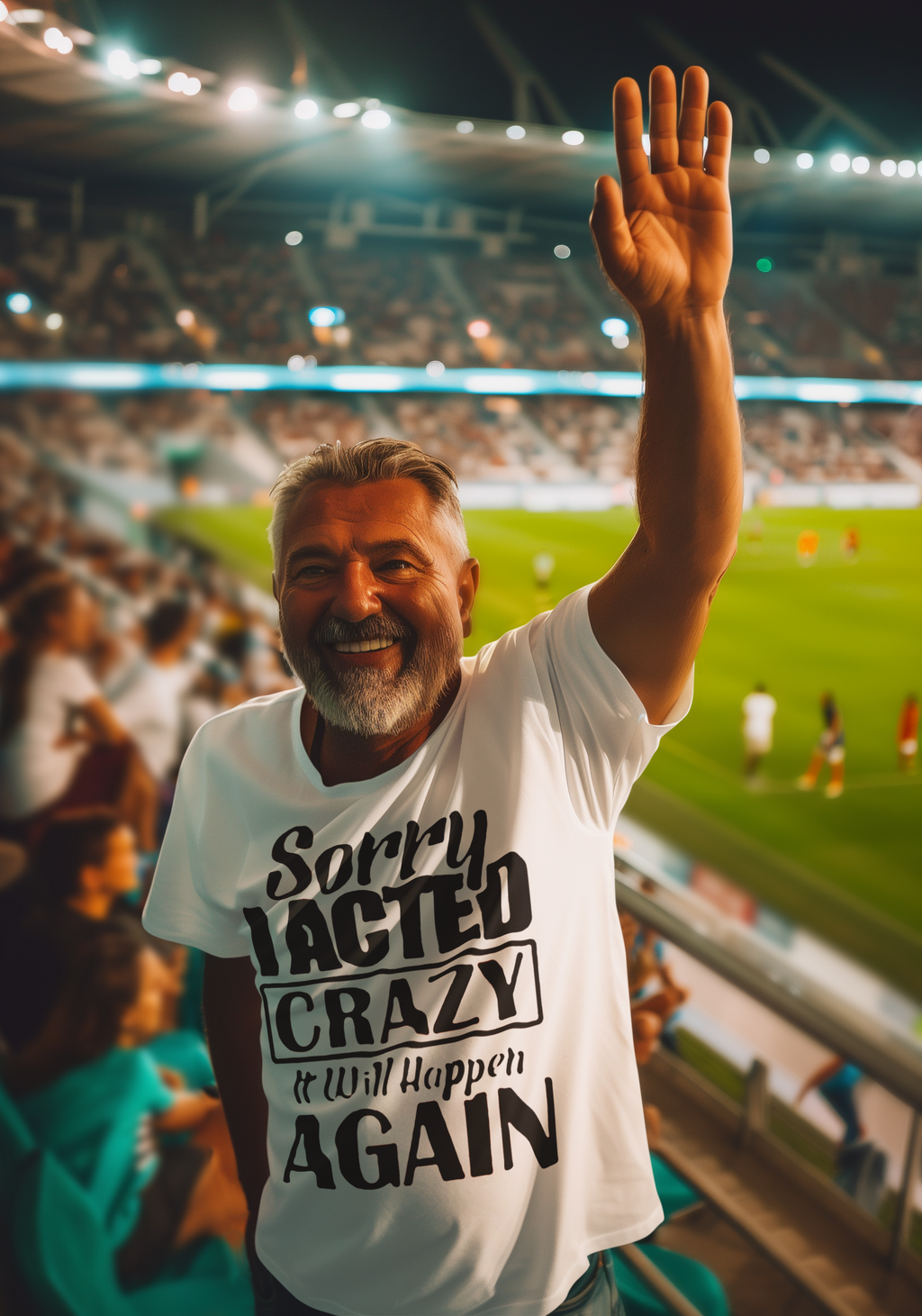 Man smiling at a stadium wearing "Sorry I Acted Crazy Funny Statement Tee" raising his arm.