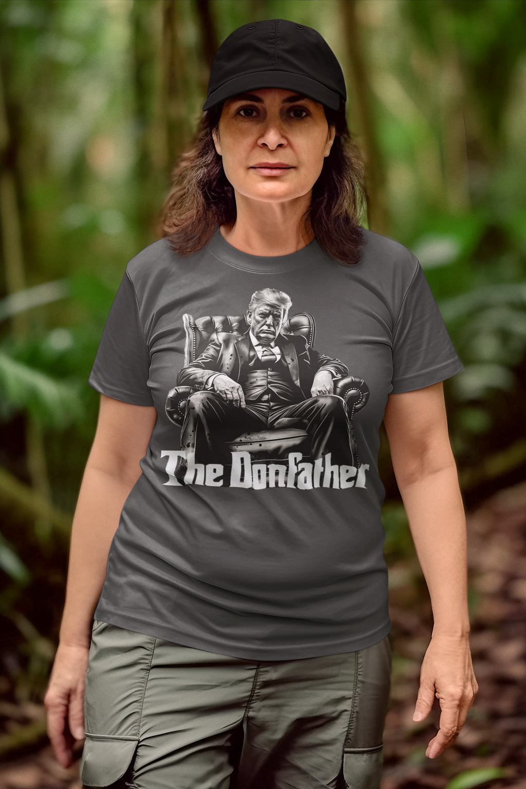 Woman wearing The Donfather Seated Vintage Design t-shirt in a lush green forest.