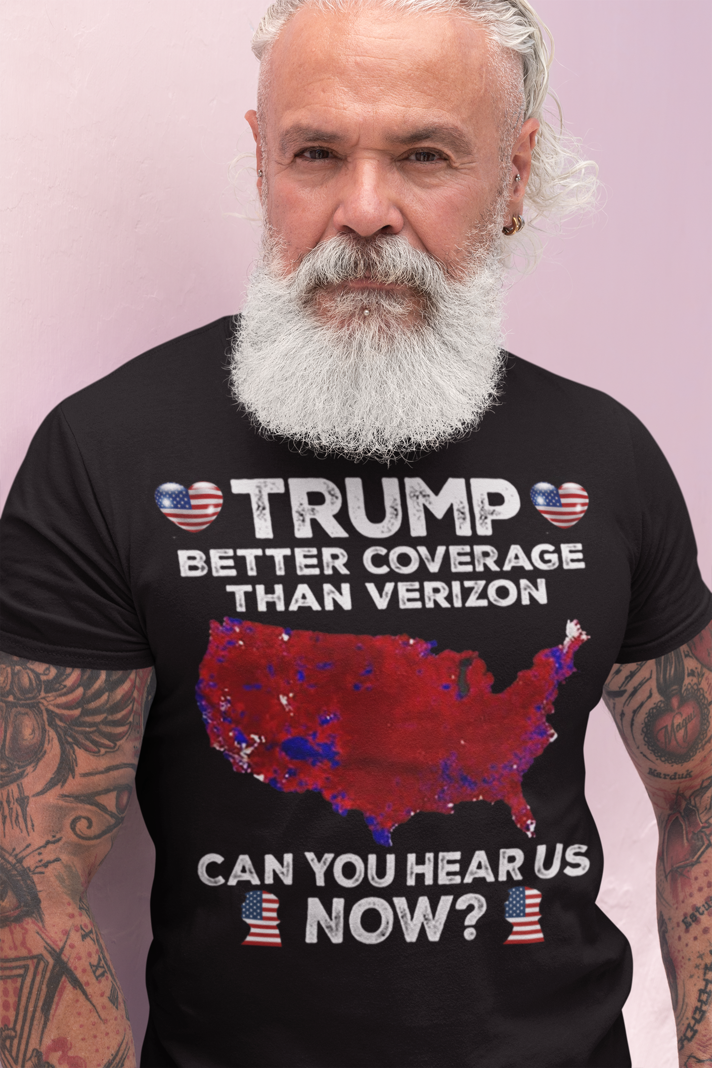 Man wearing a graphic tee that reads 'TRUMP BETTER COVERAGE THAN VERIZON' featuring a map of the USA.