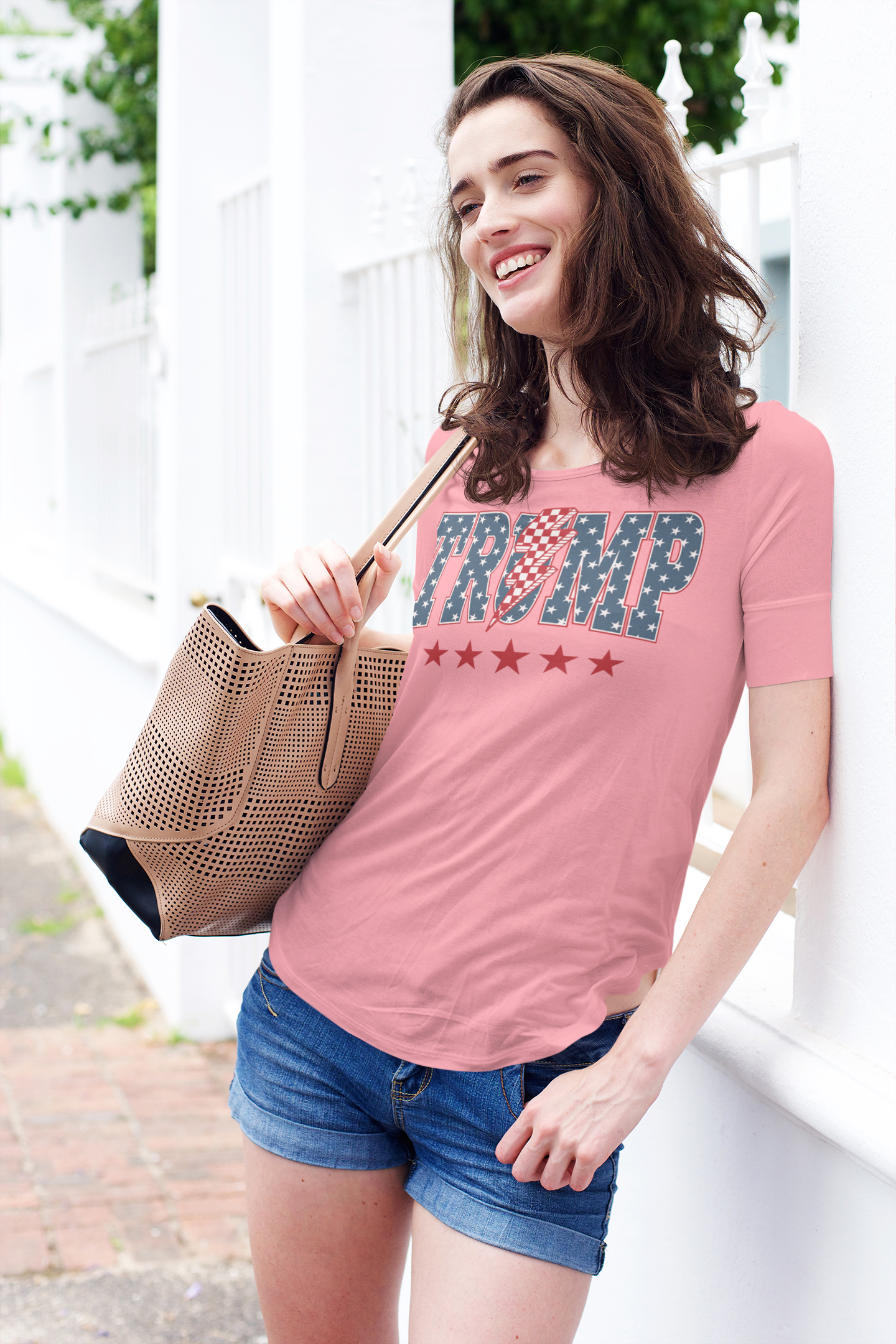 Model wearing the Trump Lightning Bolt Graphic Tee with a stylish handbag, showcasing a patriotic design.