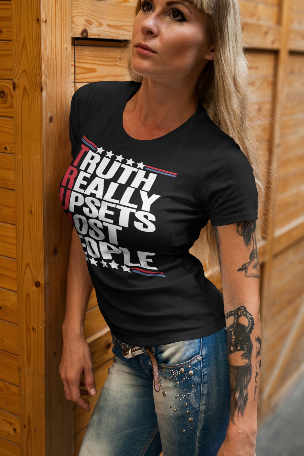Woman wearing Truth Really Upsets Most People t-shirt, showcasing personal values and patriotism.
