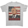 Trump 2028 USA Flag Motif Gear graphic tee featuring a portrait of Trump against an American flag background.
