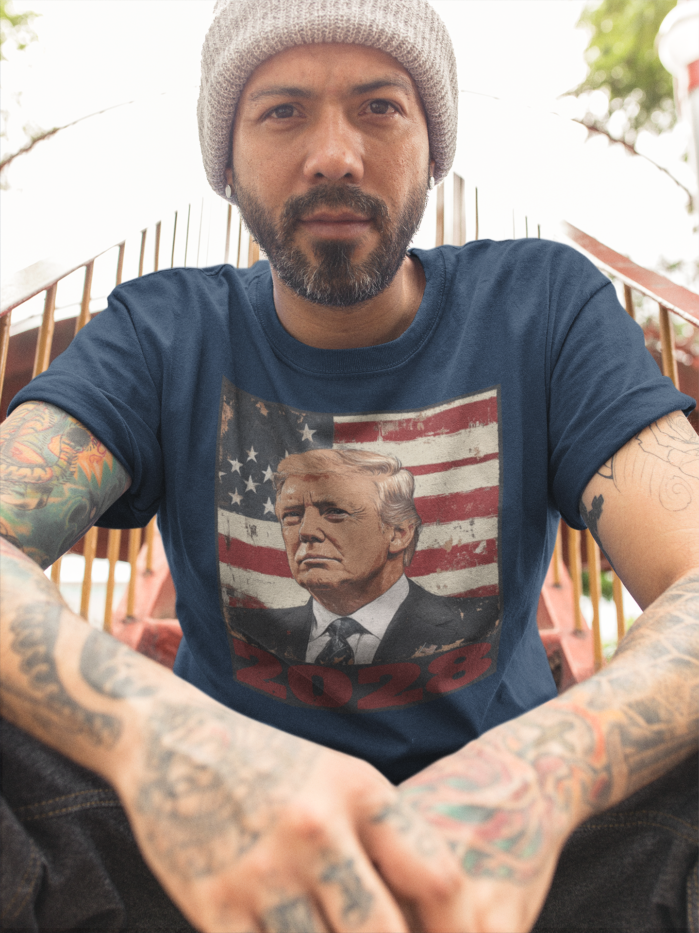 Man wearing Trump 2028 US Flag Apparel Style t-shirt with patriotic design and tattoos.
