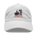White cap featuring Trump Shot 2028 Graphic Design with patriotic elements and graphic of a rally.