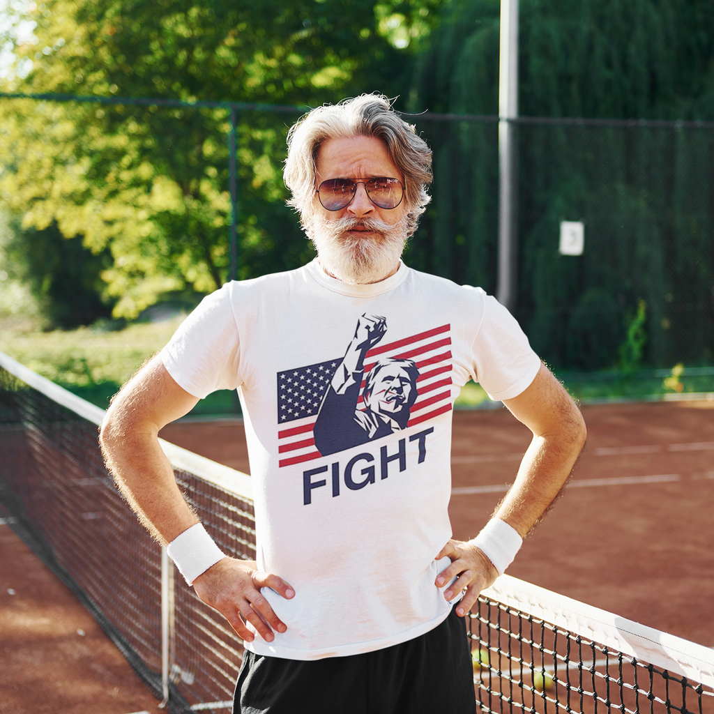 Man wearing Fight Bold American Pride Graphic shirt on a tennis court, embodying strength and patriotism.