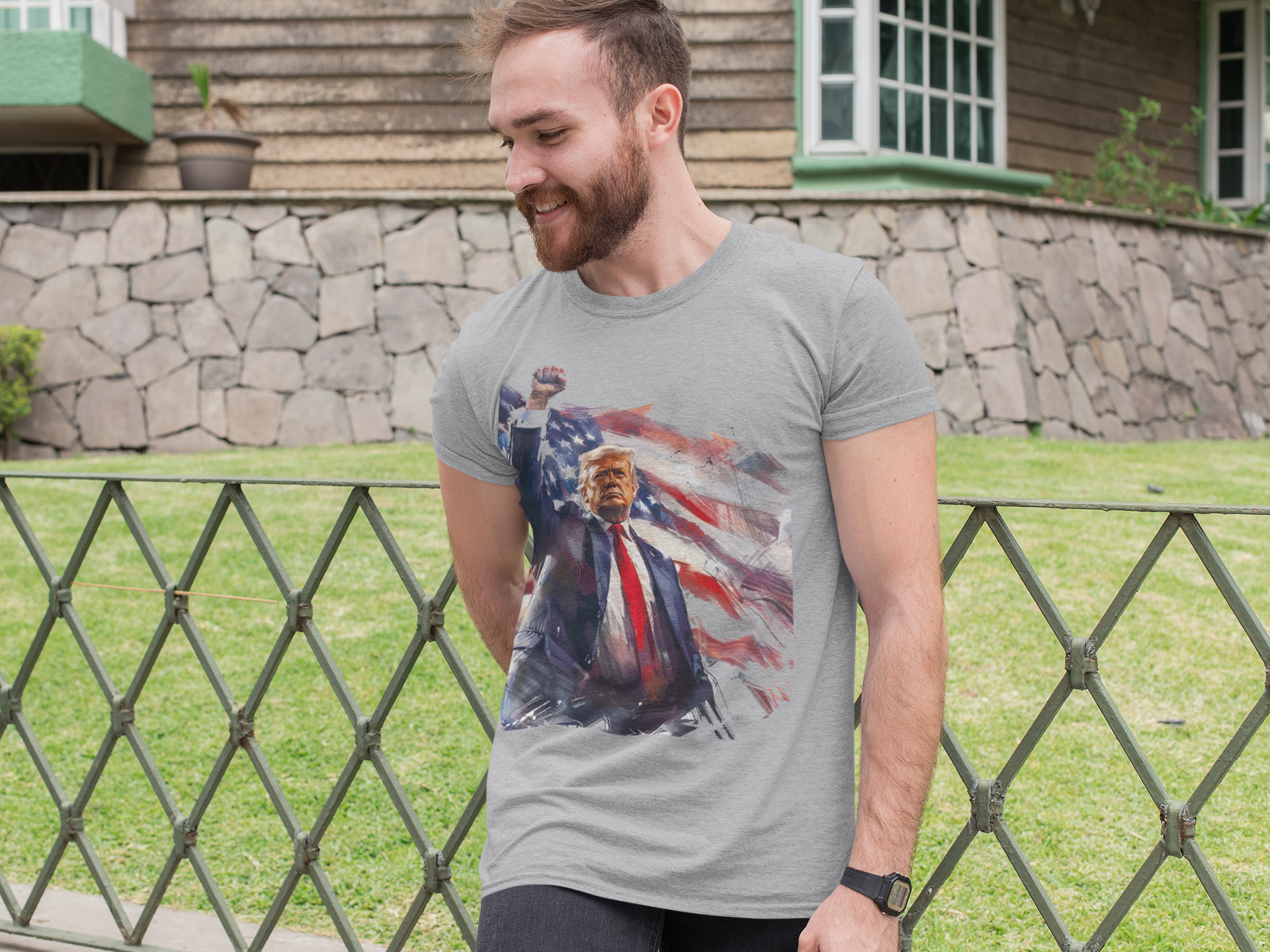 Man wearing Trump Fist Up Stars And Stripes graphic tee outdoors with a smiling expression.