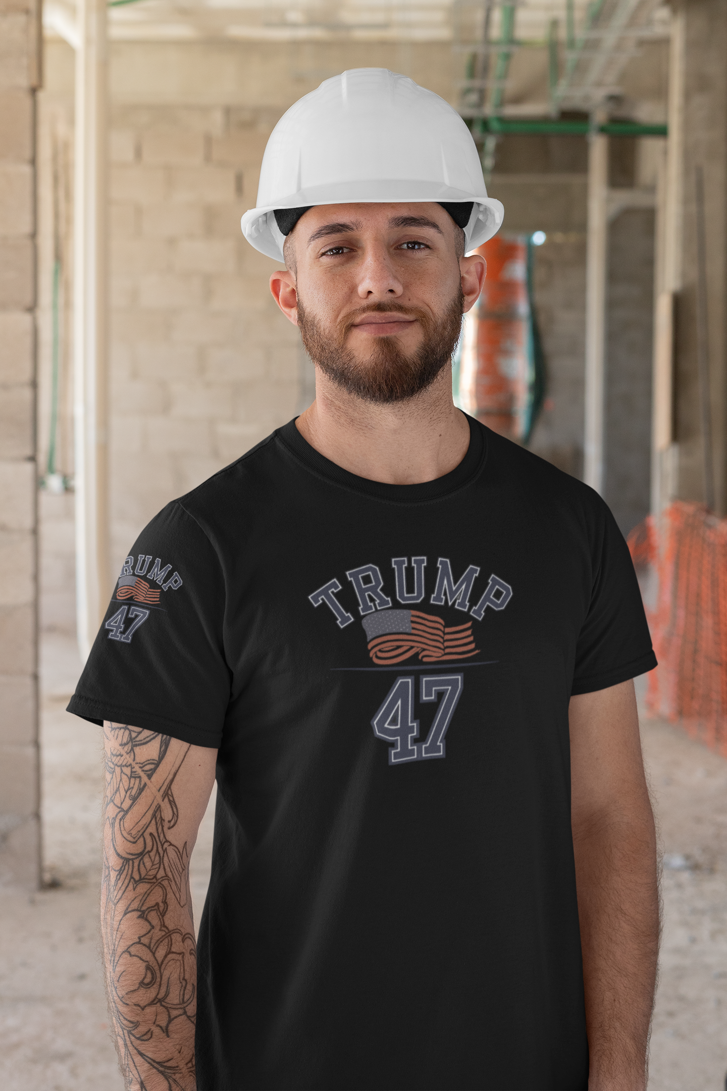 Man wearing a Trump 47 Patriotic Banner Print shirt and hard hat at a construction site.