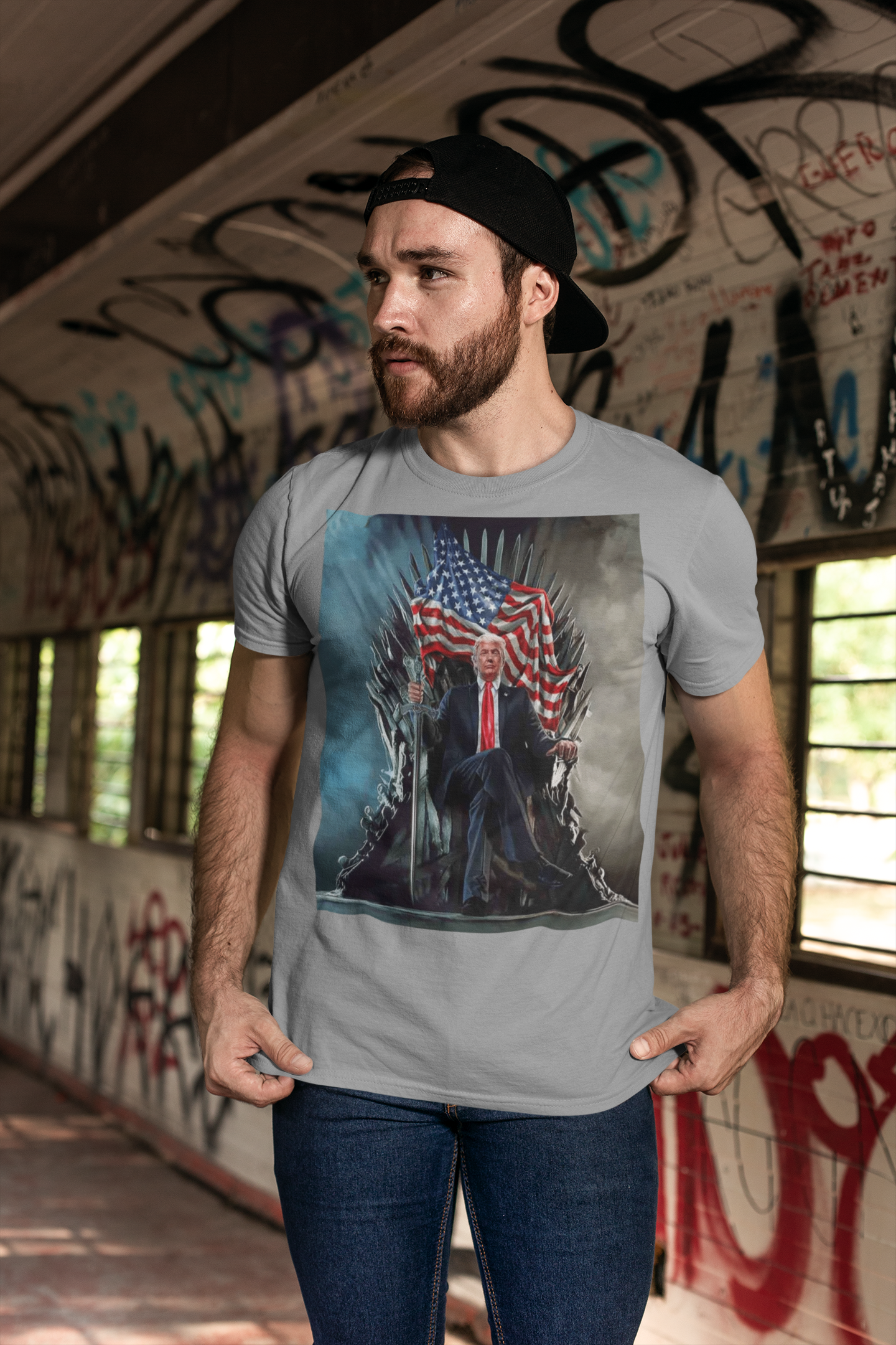 Man wearing Trump On Throne American Flag Tee in an urban setting with graffiti.